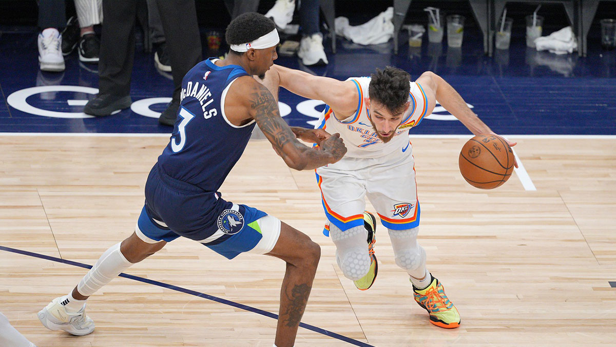 Oklahoma City Thunder forward Chet Holmgren (7) dribbles the ball against Minnesota Timberwolves forward Jaden McDaniels (3) during the second half in game three of the western conference finals for the 2025 NBA Playoffs at Target Center.