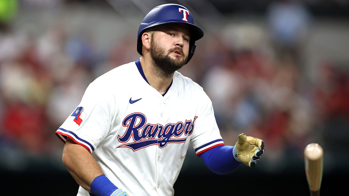 Texas Rangers first base Jake Burger (21) tosses his bat after being hit by a pitch during the second inning against the Oakland Athletics.