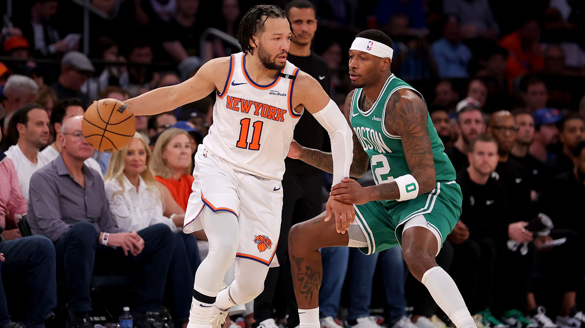 New York Knicks guard Jalen Brunson (11) controls the ball against Boston Celtics forward Torrey Craig (12) during the fourth quarter of game six in the second round of the 2025 NBA Playoffs at Madison Square Garden.