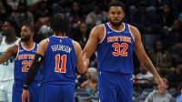 New York Knicks center Karl-Anthony Towns (32) reacts with guard Jalen Brunson (11) during the third quarter against the Memphis Grizzlies at FedExForum.