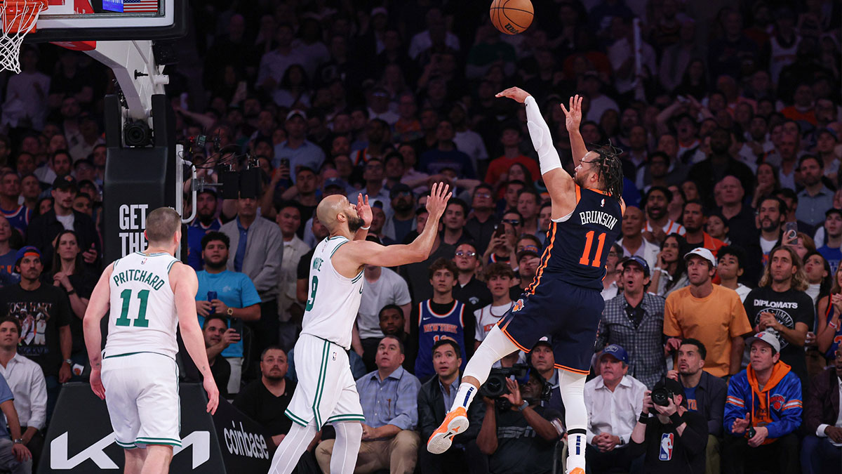New York Knicks guard Jalen Brunson (11) makes a basket in front ofBoston Celtics guard Derrick White (9) in the second half during game four of the second round for the 2025 NBA Playoffs at Madison Square Garden.