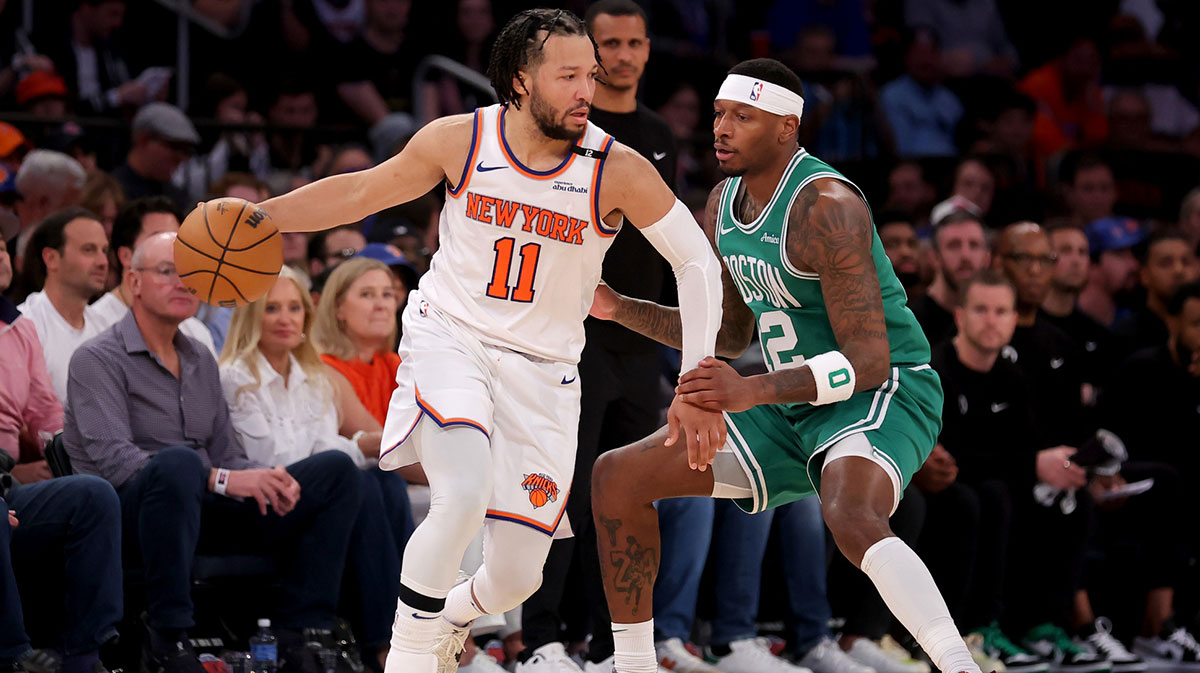 New York Knicks guard Jalen Brunson (11) controls the ball against Boston Celtics forward Torrey Craig (12) during the fourth quarter of game six in the second round of the 2025 NBA Playoffs at Madison Square Garden.