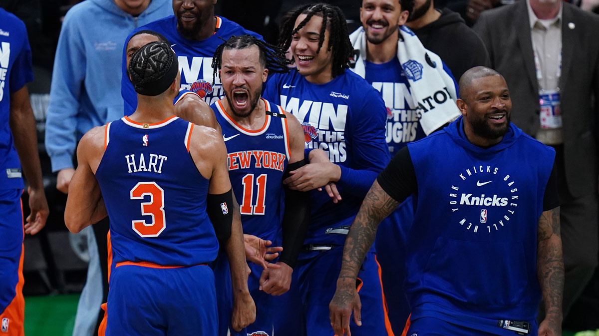New York Knicks guard Jalen Brunson (11) reacts with teammates after defeating the Boston Celtics in overtime during game one of the second round for the 2025 NBA Playoffs at TD Garden.
