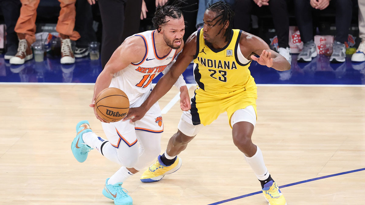 New York Knicks guard Jalen Brunson (11) controls the ball against Indiana Pacers forward Aaron Nesmith (23) in the fourth quarter during game two of the eastern conference finals for the 2025 NBA Playoffs at Madison Square Garden.