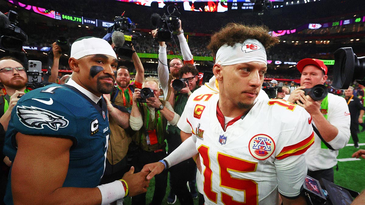 Philadelphia Eagles quarterback Jalen Hurts (1) shakes hands with Kansas City Chiefs quarterback Patrick Mahomes (15) after Super Bowl LIX at Ceasars Superdome.