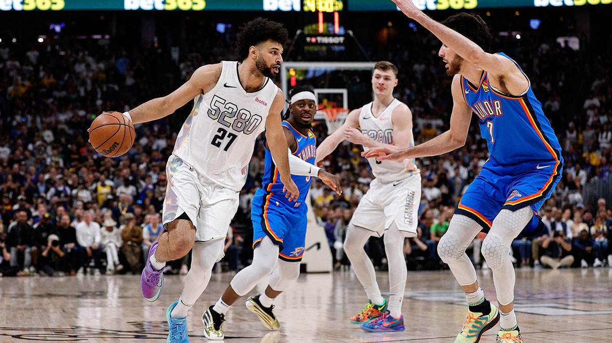 Denver Nuggets guard Jamal Murray (27) controls the ball as Oklahoma City Thunder forward Chet Holmgren (7) guards in the third quarter during game six of the second round for the 2025 NBA Playoffs at Ball Arena.