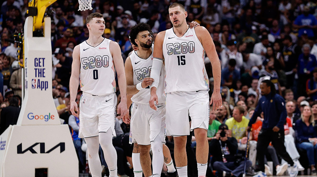 Denver Nuggets guard Jamal Murray (27) controls the ball as Oklahoma City Thunder forward Chet Holmgren (7) guards in the third quarter during game six of the second round for the 2025 NBA Playoffs at Ball Arena.