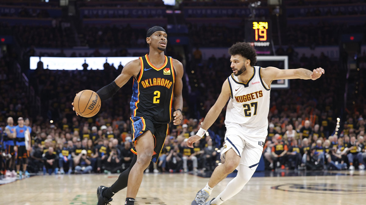 Oklahoma City Thunder guard Shai Gilgeous-Alexander (2) drives down the court beside Denver Nuggets guard Jamal Murray (27) in the second half during game two of the second round for the 2025 NBA Playoffs at Paycom Center.
