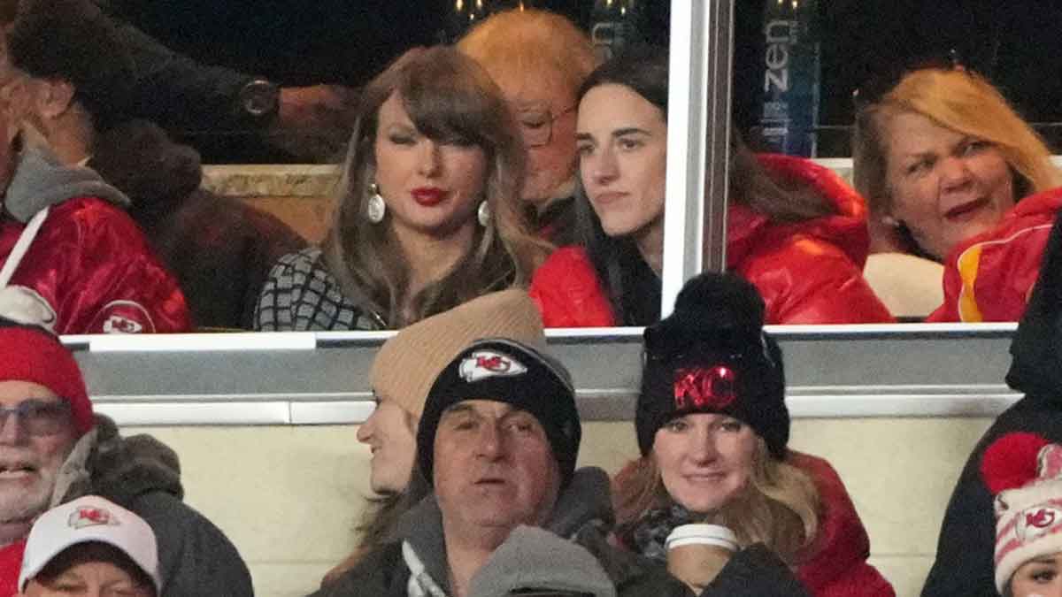 Jan 18, 2025; Kansas City, Missouri, USA; Recording artist Taylor Swift (upper middle) sits with Indiana Fever guard Caitlin Clark (upper right) during the fourth quarter of a 2025 AFC divisional round game between the Kansas City Chiefs and the Houston Texans at GEHA Field at Arrowhead Stadium. Mandatory Credit: Denny Medley-Imagn Images