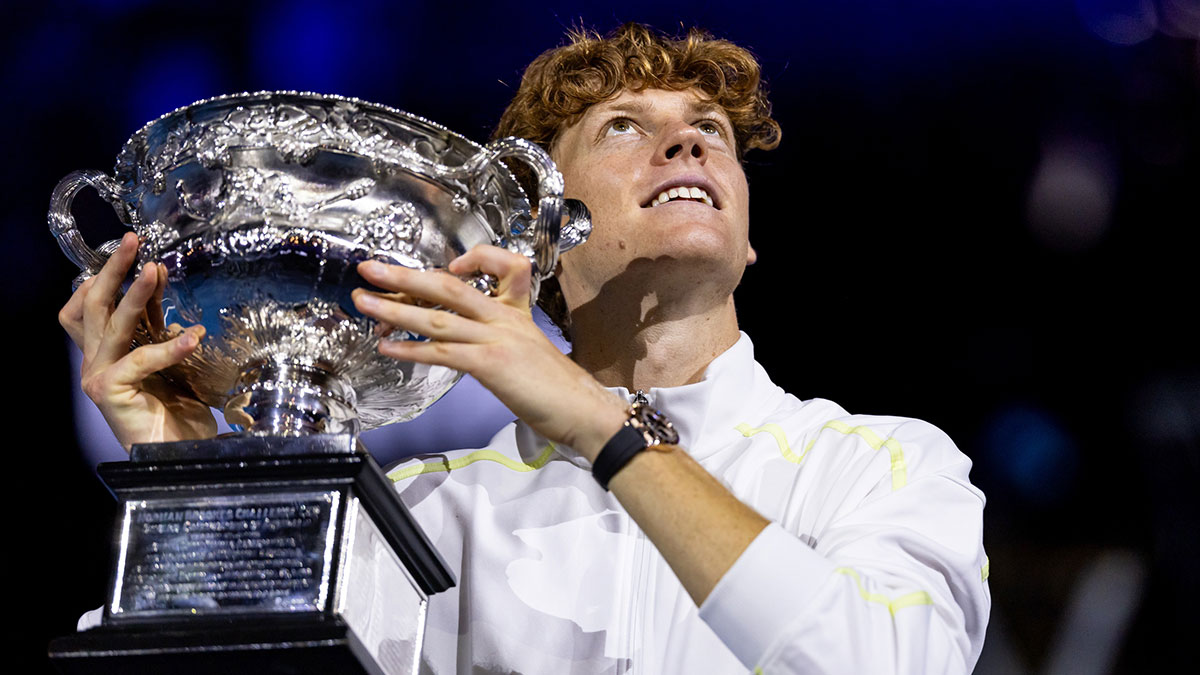 Jan 26, 2025; Melbourne, Victoria, Australia; Jannik Sinner of Italy celebrates with the Australian Open title during the prize presentation of the men's single at the 2025 Australian Open at Melbourne Park. Mandatory Credit: Mike Frey-Imagn Images