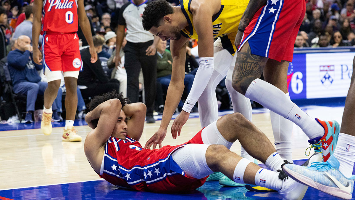 Philadelphia 76ers guard Jared McCain (20) holds his head next to Indiana Pacers guard Tyrese Haliburton (0) after a hard fall during the third quarter.