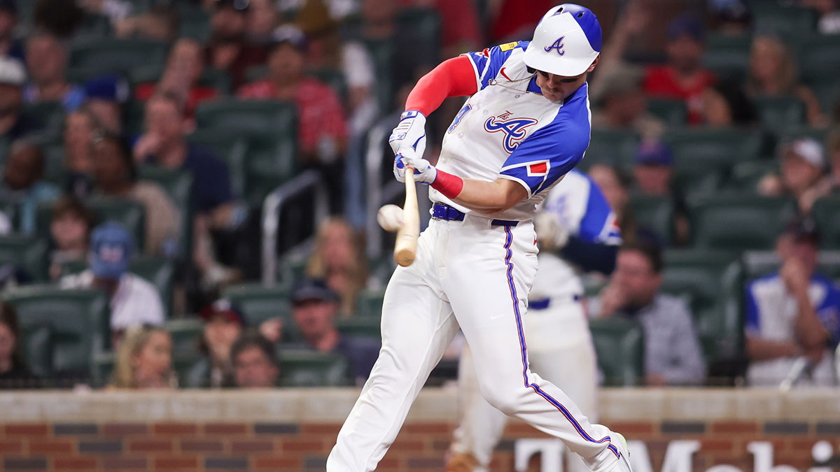 Atlanta Braves right fielder Jarred Kelenic (24) hits a single against the Minnesota Twins in the sixth inning at Truist Park.