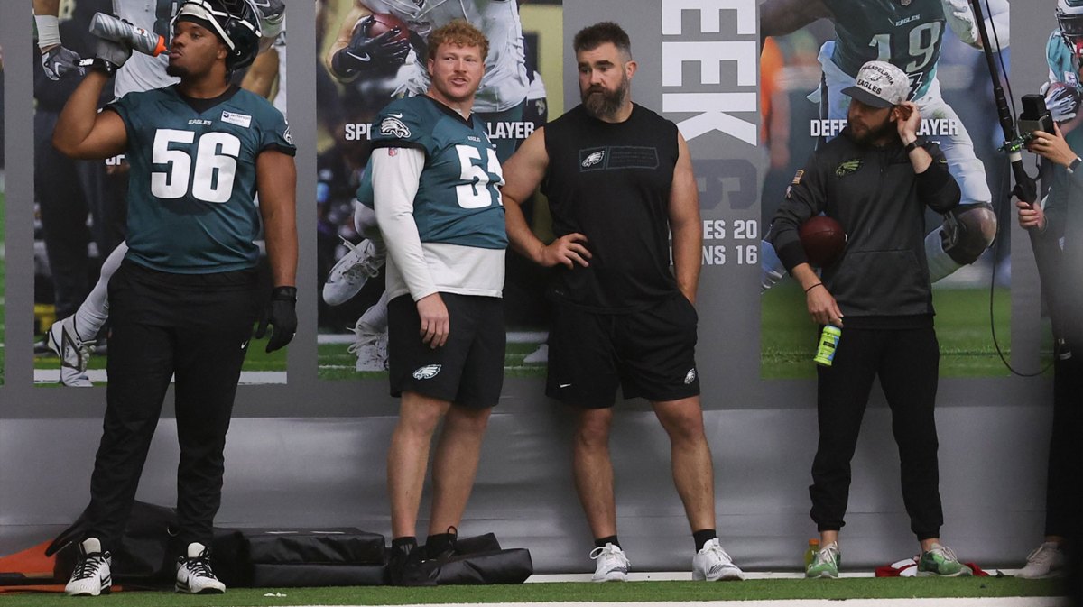 Philadelphia Eagles center Cam Jurgens (51) talks with former Eagles Jason Kelce during OTAs at NovaCare Complex.
