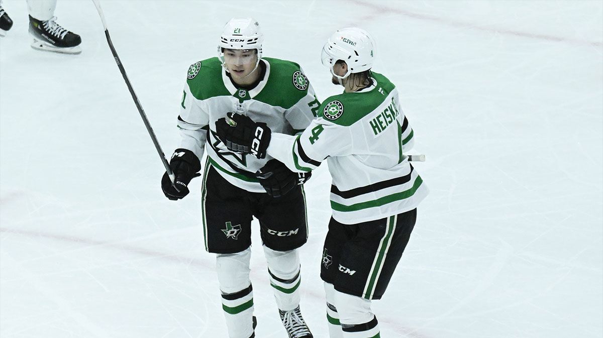 Dallas Stars left wing Jason Robertson (21) reacts with defenseman Miro Heiskanen (4) after he scores a goal against the Chicago Blackhawks during the second period at United Center.