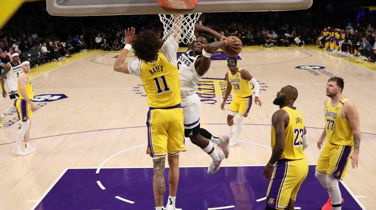 Los Angeles, California, USA; Minnesota Timberwolves guard Anthony Edwards (5) dunks the ball against Los Angeles Lakers center Jaxson Hayes (11) during the second half of game two of first round for the 2024 NBA Playoffs at Crypto.com Arena.
