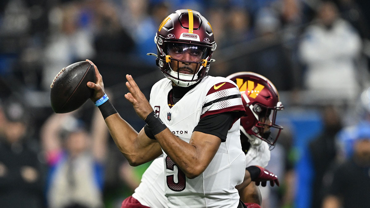 Washington Commanders quarterback Jayden Daniels (5) throws a pass during the first quarter against Detroit Lions in a 2025 NFC divisional round game at Ford Field.