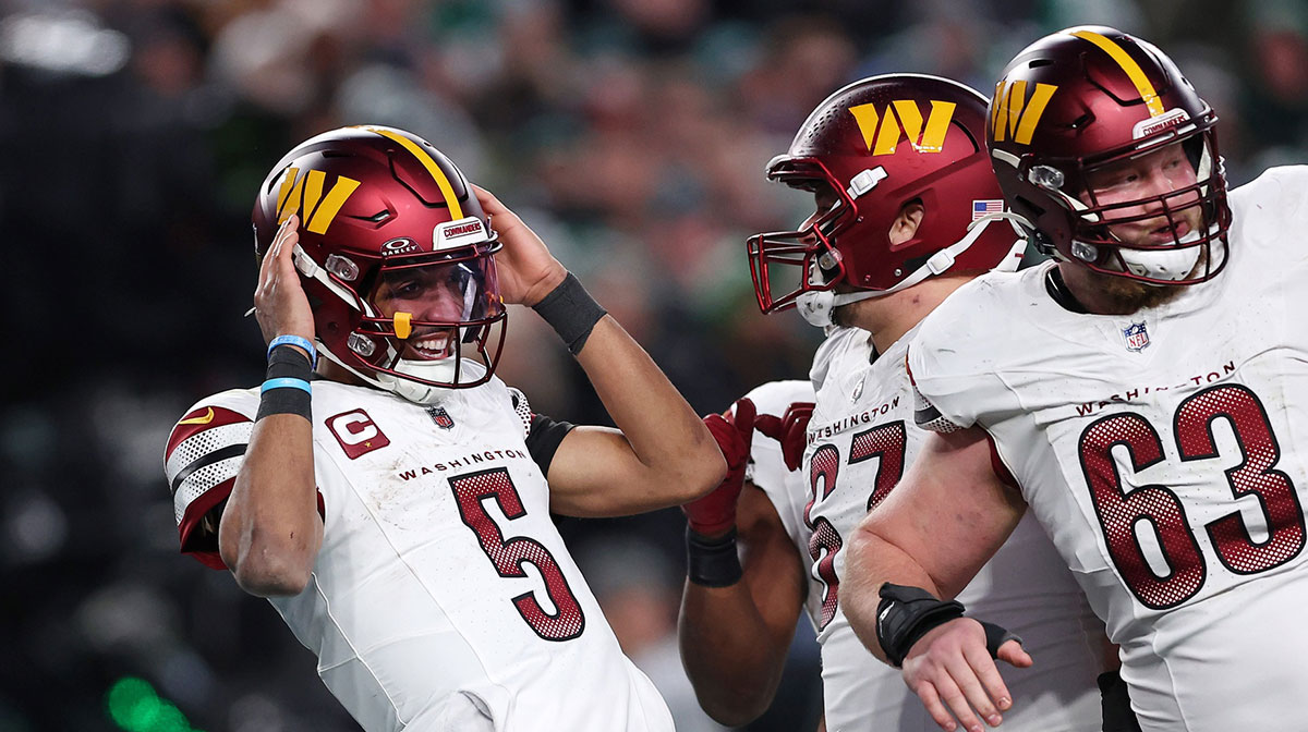 Washington Commanders quarterback Jayden Daniels (5) celebrates after a play against the Philadelphia Eagles during the second half in the NFC Championship game at Lincoln Financial Field.