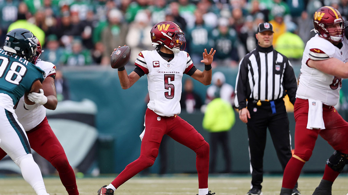 Washington Commanders quarterback Jayden Daniels (5) looks to pass the ball against the Philadelphia Eagles during the first half of the NFC Championship game at Lincoln Financial Field.