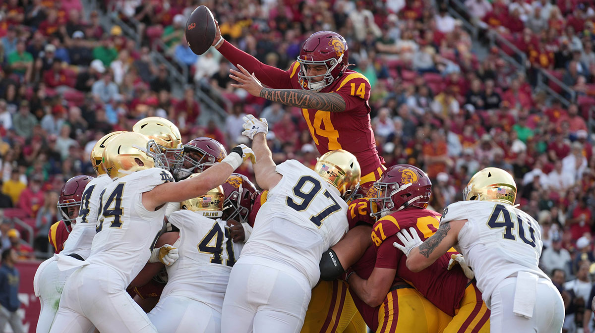Southern California Trojans quarterback Jayden Maiava (14) scores on a 1-yard touchdown run against the Notre Dame Fighting Irish in the second half at United Airlines Field at Los Angeles Memorial Coliseum.