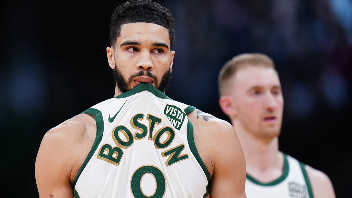 Boston Celtics forward Jayson Tatum (0) and forward Sam Hauser (30) on the court against the Denver Nuggets in the second half at TD Garden.