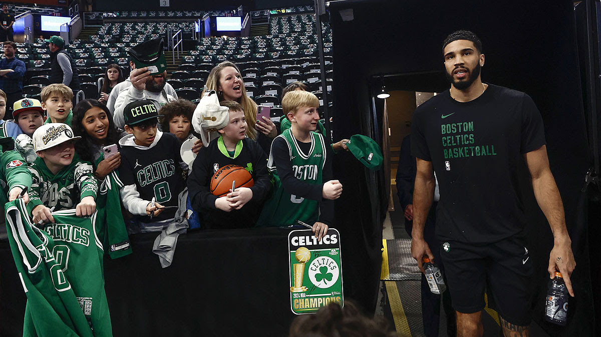 Young fans greet Boston Celtics forward Jayson Tatum (0) as he takes the court for warm ups before their game against the Cleveland Cavaliers.