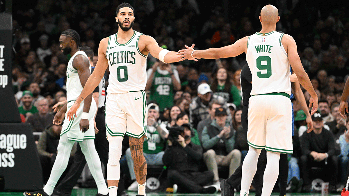 Boston Celtics forward Jayson Tatum (0) reacts to game play with guard Derrick White (9) during the first half against the Orlando Magic at TD Garden. Payton Pritchard