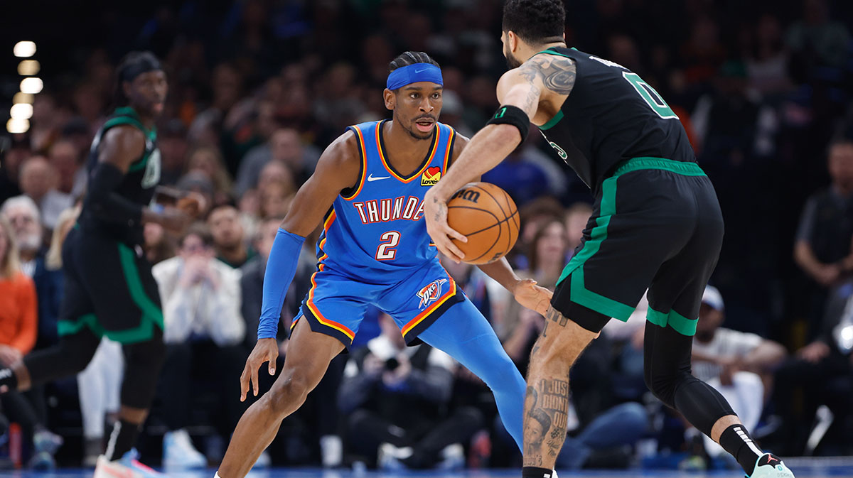 Oklahoma City Thunder guard Shai Gilgeous-Alexander (2) defends Boston Celtics forward Jayson Tatum (0) during the second quarter at Paycom Center.