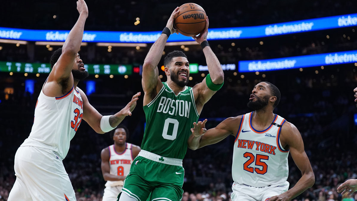New York Knicks forward Mikal Bridges (25) and center Karl-Anthony Towns (32) defend against Boston Celtics forward Jayson Tatum (0) in the second half during game two of the second round for the 2025 NBA Playoffs at TD Garden.