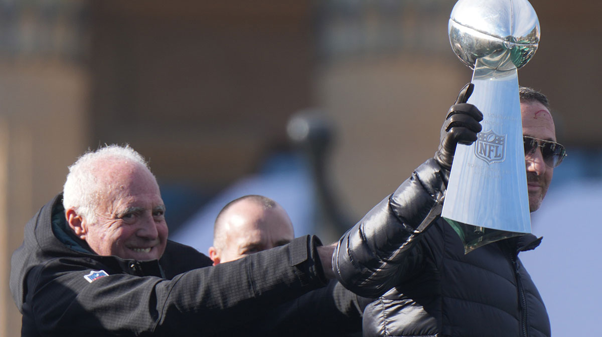 Philadelphia Eagles general manager Howie Roseman with the Vince Lombardi Trophy as owner Jeffrey Lurie looks on during the Super Bowl LIX championship parade and rally.