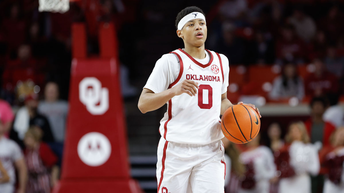 Oklahoma Sooners guard Jeremiah Fears (0) dribbles down the court against the Mississippi State Bulldogs during the second half at Lloyd Noble Center.
