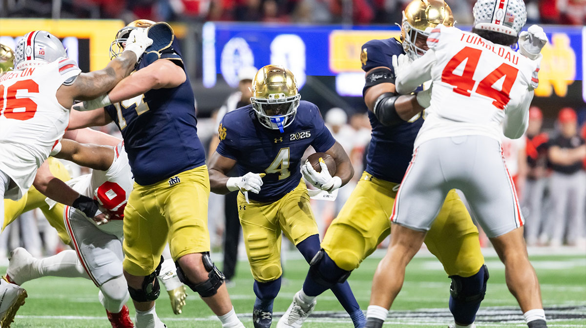 Notre Dame Fighting Irish running back Jeremiyah Love (4) against the Ohio State Buckeyes during the CFP National Championship college football game at Mercedes-Benz Stadium.