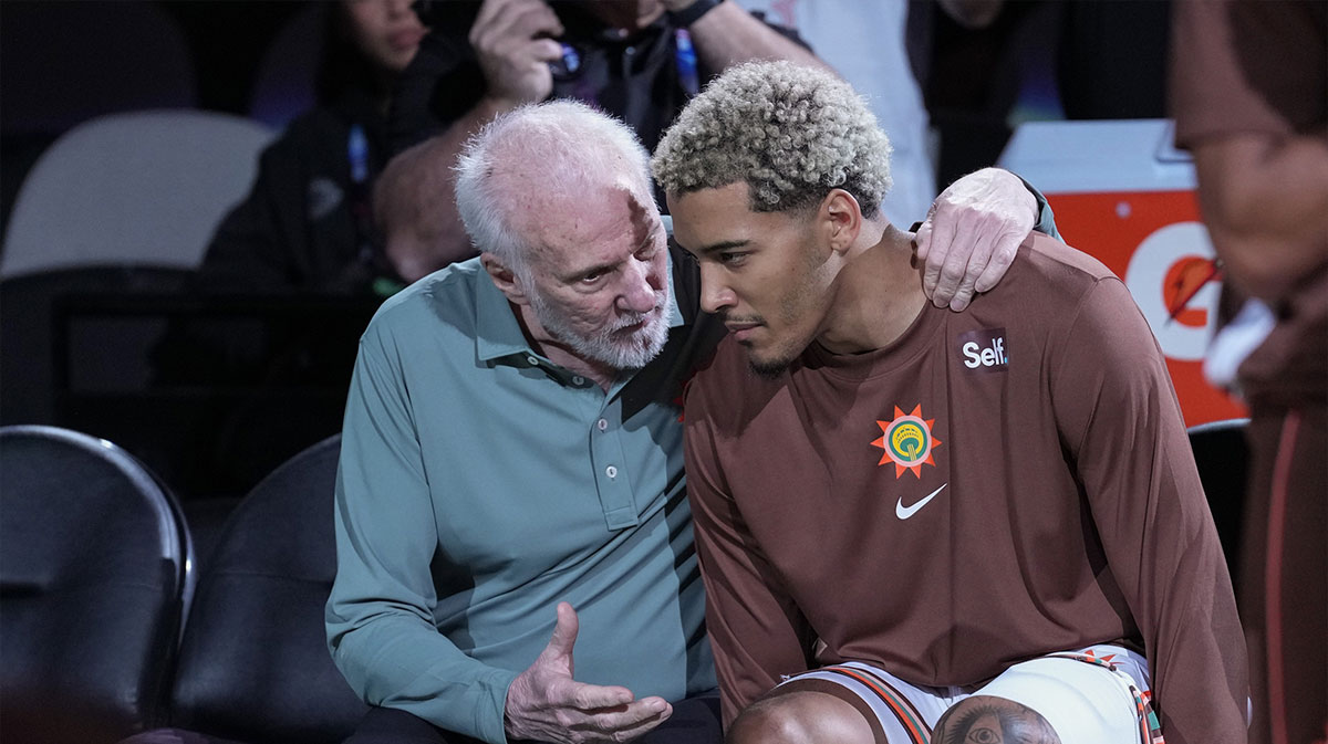 San Antonio Spurs head coach Gregg Popovich talks with forward Jeremy Sochan (10) before introductions for the game against the LA Clippers at the Frost Bank Center.