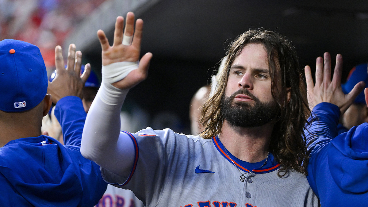 New York Mets designated hitter Jesse Winker (3) is congratulated by teammates after scoring against the St. Louis Cardinals during the second inning at Busch Stadium.