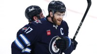 Winnipeg Jets center Adam Lowry (17) celebrates his goal in the second overtime against the St. Louis Blues in game seven of the first round of the 2025 Stanley Cup Playoffs at Canada Life Centre.