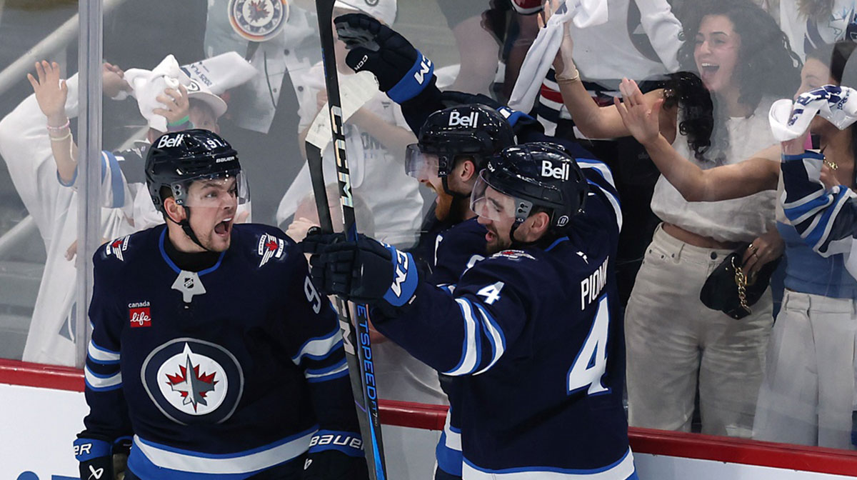 Winnipeg Jets center Cole Perfetti (91) celebrates his goal against the St. Louis Blues with teammates in the third period in game seven of the first round of the 2025 Stanley Cup Playoffs at Canada Life Centre. Mandatory Credit: