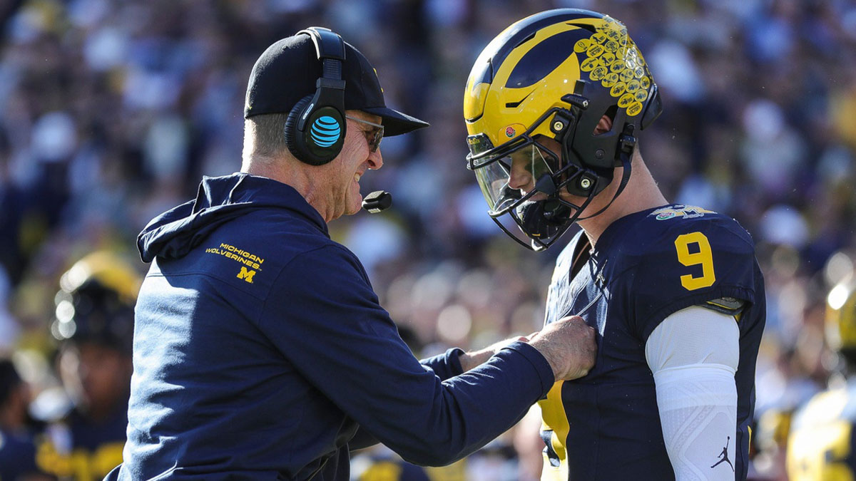 Michigan coach Jim Harbaugh talks to quarterback J.J. McCarthy before the start of the Rose Bowl vs. Alabama