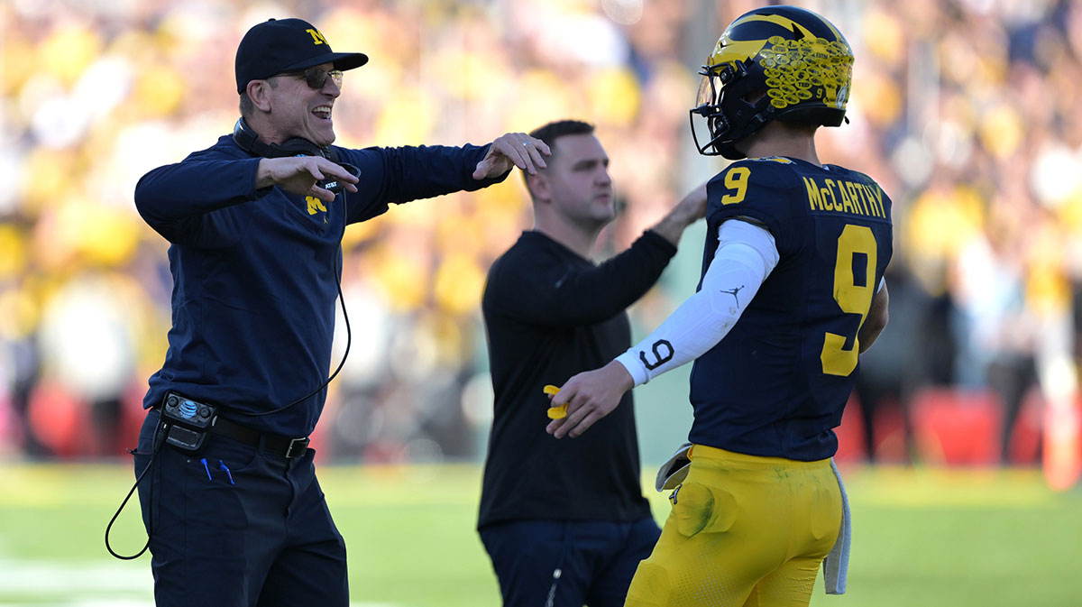 Michigan Wolverines head coach Jim Harbaugh (left) congratulates quarterback J.J. McCarthy (9) after a touchdown against the Alabama Crimson Tide during the first half in the 2024 Rose Bowl college football playoff semifinal game at Rose Bowl.