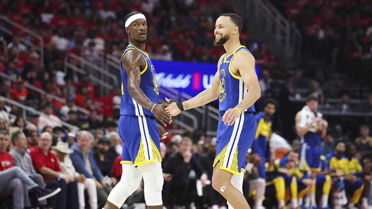 Golden State Warriors guard Stephen Curry (30) celebrates with forward Jimmy Butler III (10) after a play during the second quarter against the Houston Rockets at Toyota Center.
