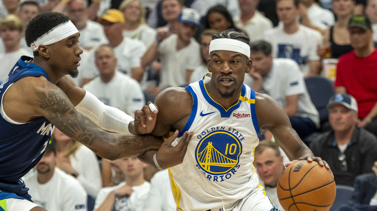 Golden State Warriors forward Jimmy Butler III (10) drives to the basket past Minnesota Timberwolves forward Jaden McDaniels (3) in the second half during game five of the second round for the 2025 NBA Playoffs at Target Center.