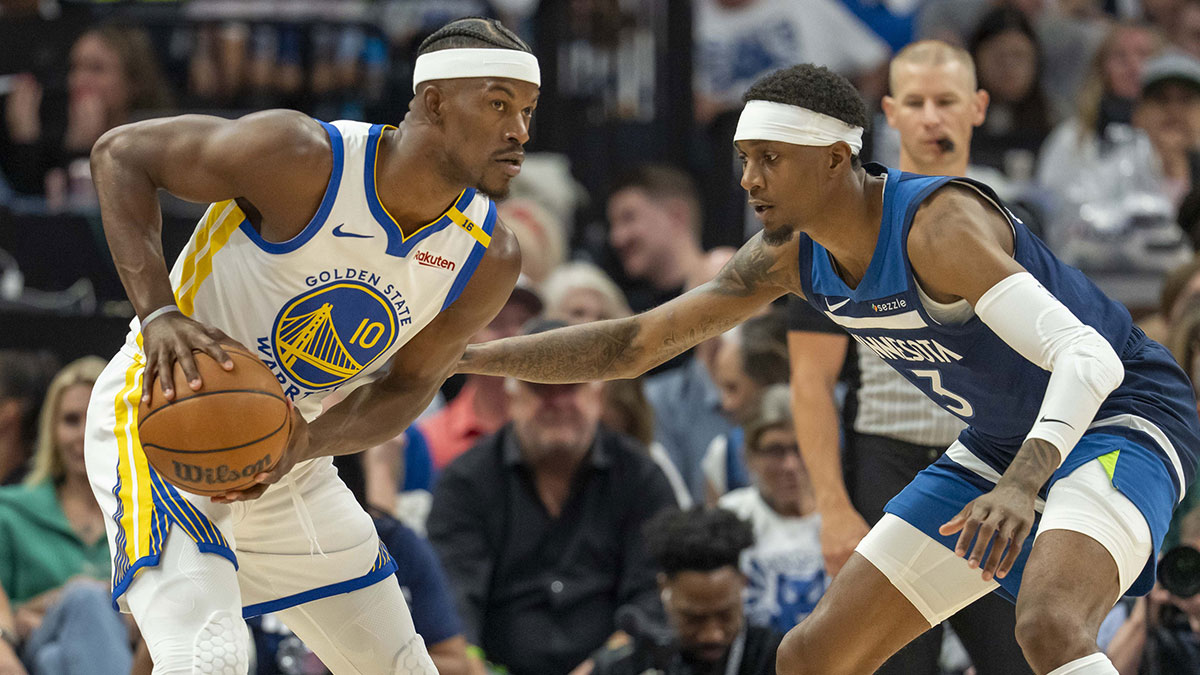 Warriors forward Jimmy Butler III (10) holds the ball
