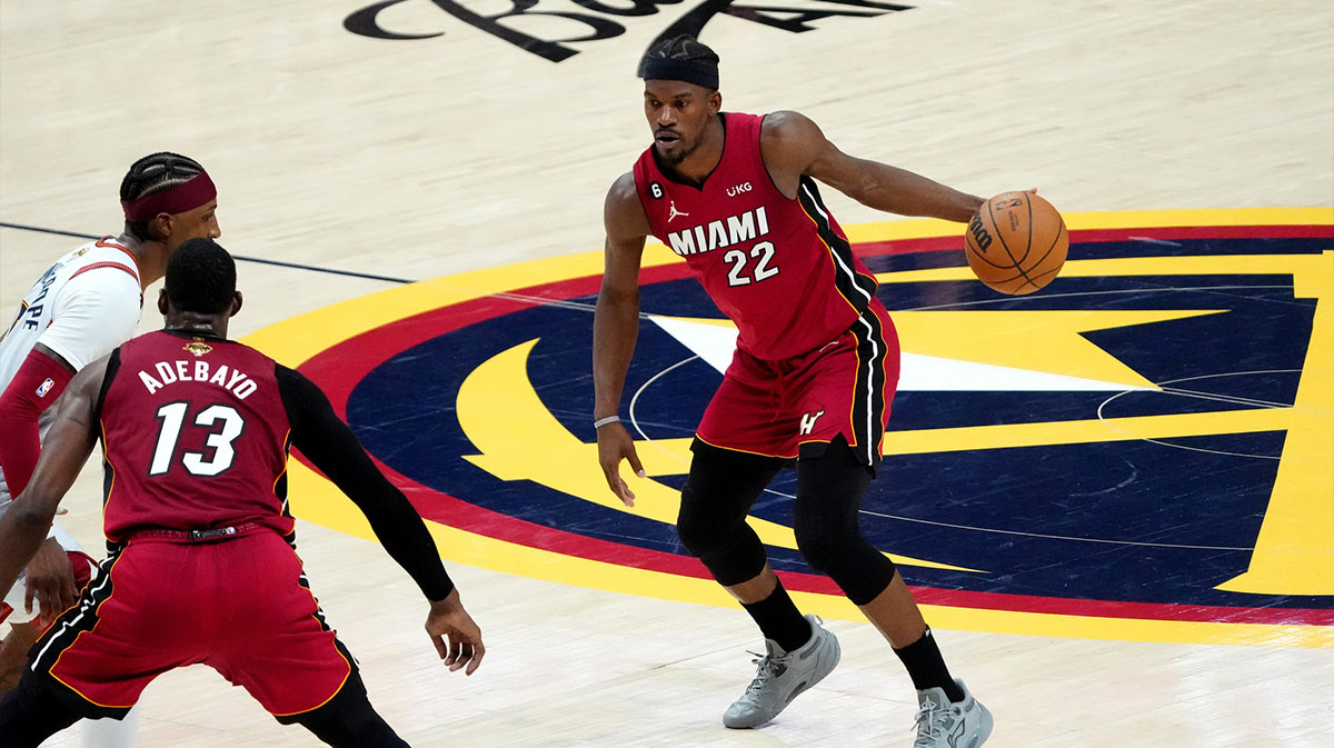 Miami Heat forward Jimmy Butler (22) dribbles during the fourth quarter of game five of the 2023 NBA Finals against the Denver Nuggets at Ball Arena.