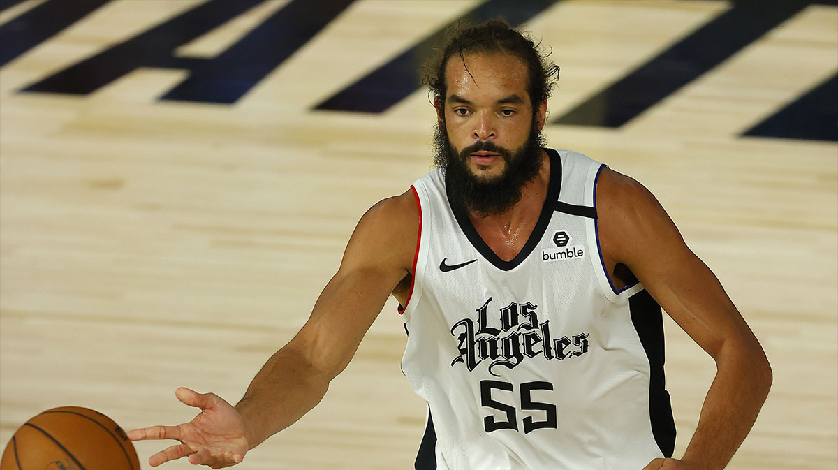 Joakim Noah #55 of the LA Clippers dribbles the ball against the Oklahoma City Thunder during overtime at The Field House at ESPN Wide World of Sports Complex. 