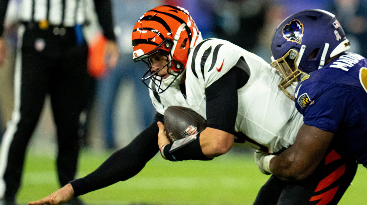 Baltimore Ravens defensive tackle Nnamdi Madubuike (92) tackles Cincinnati Bengals quarterback Joe Burrow (9) in the third quarter of the NFL game at M&T Banks Stadium in Baltimore on Thursday, Nov. 7, 2024.