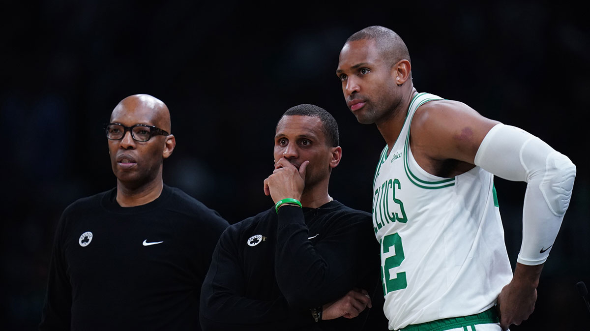 Boston Celtics head coach Joe Mazzulla talks with center Al Horford (42) from the sideline as they take on the New York Knicks during game one of the second round for the 2025 NBA Playoffs at TD Garden.