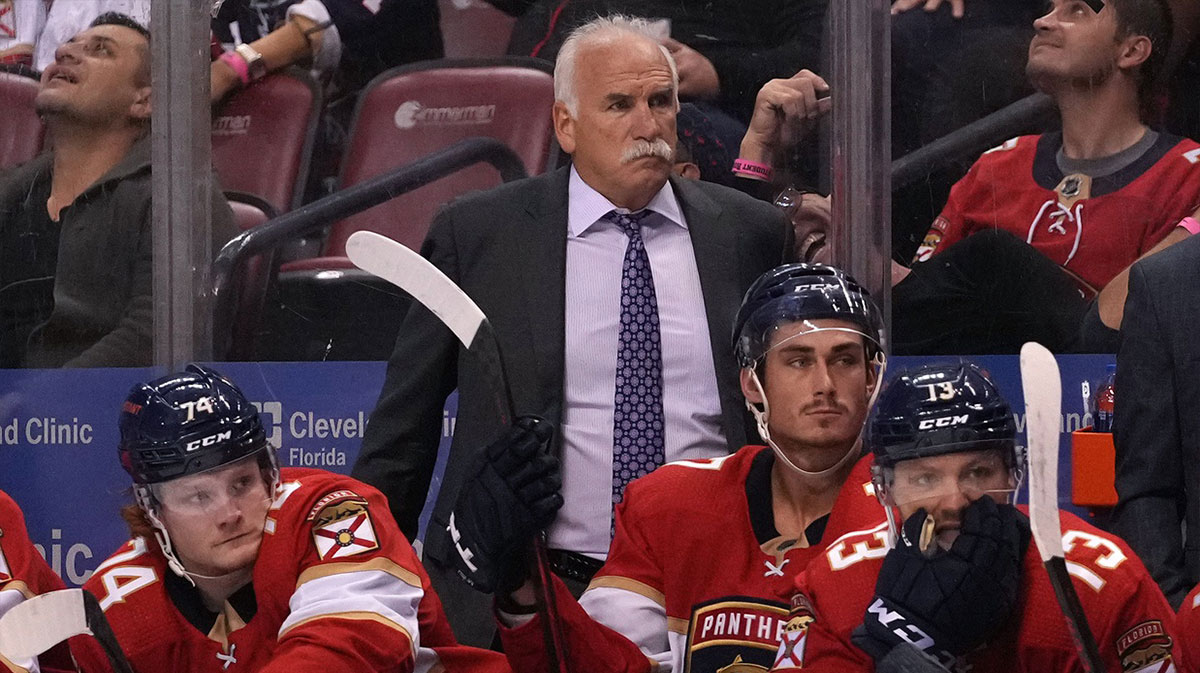 Florida Panthers head coach Joel Quenneville watches from the bench behind his players during the second period against the Boston Bruins at FLA Live Arena