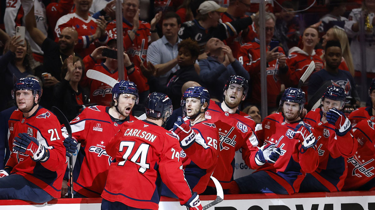 Washington Capitals defenseman John Carlson (74) celebrates with teammates after scoring a goal against the Carolina Hurricanes in the third period in game two of the second round of the 2025 Stanley Cup Playoffs at Capital One Arena.