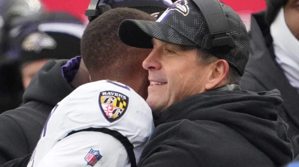 Baltimore Ravens head coach John Harbaugh embraces wide receiver Rashod Bateman (7) after his touchdown against the New York Giants in the first half.