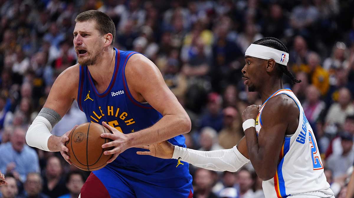 Oklahoma City Thunder guard Shai Gilgeous-Alexander (2) defends on Denver Nuggets center Nikola Jokic (15) in the second half during game three of the second round for the 2025 NBA Playoffs at Ball Arena.