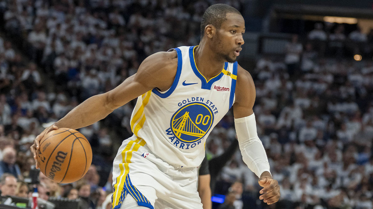Golden State Warriors forward Jonathan Kuminga (00) dribbles the ball against the Minnesota Timberwolves in the second half during game two of the second round for the 2025 NBA Playoffs at Target Center.