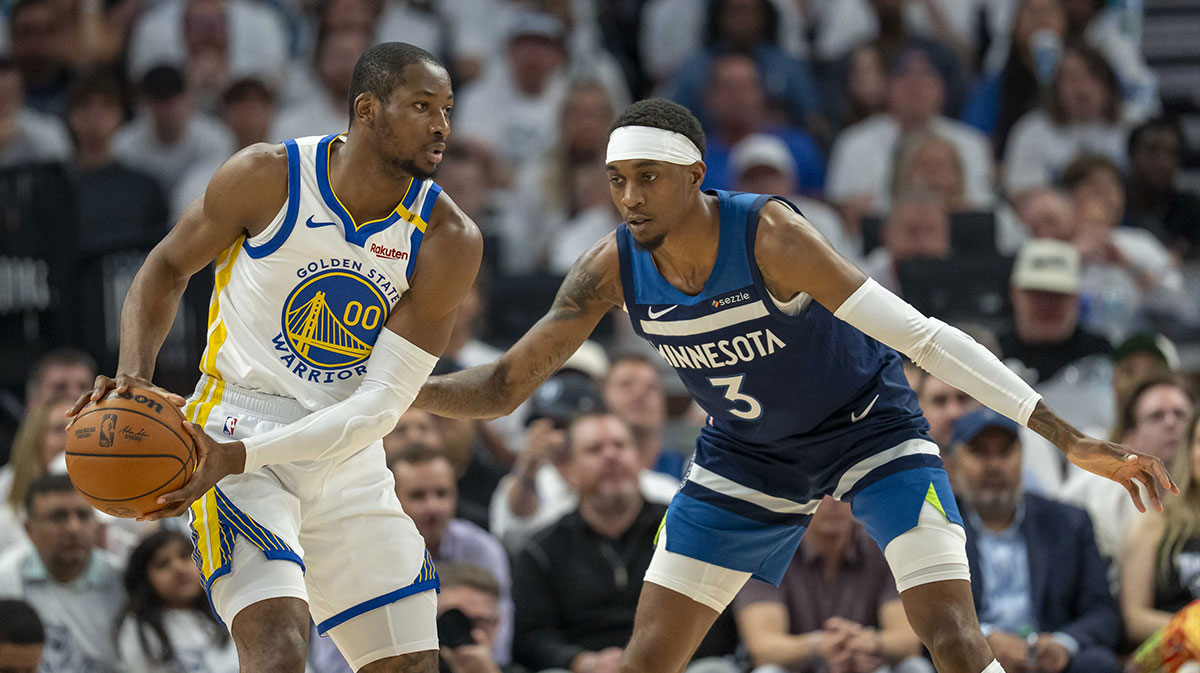 Golden State Warriors forward Jonathan Kuminga (00) looks to pass the ball as Minnesota Timberwolves forward Jaden McDaniels (3) plays defense in the first half during game five of the second round for the 2025 NBA Playoffs at Target Center.